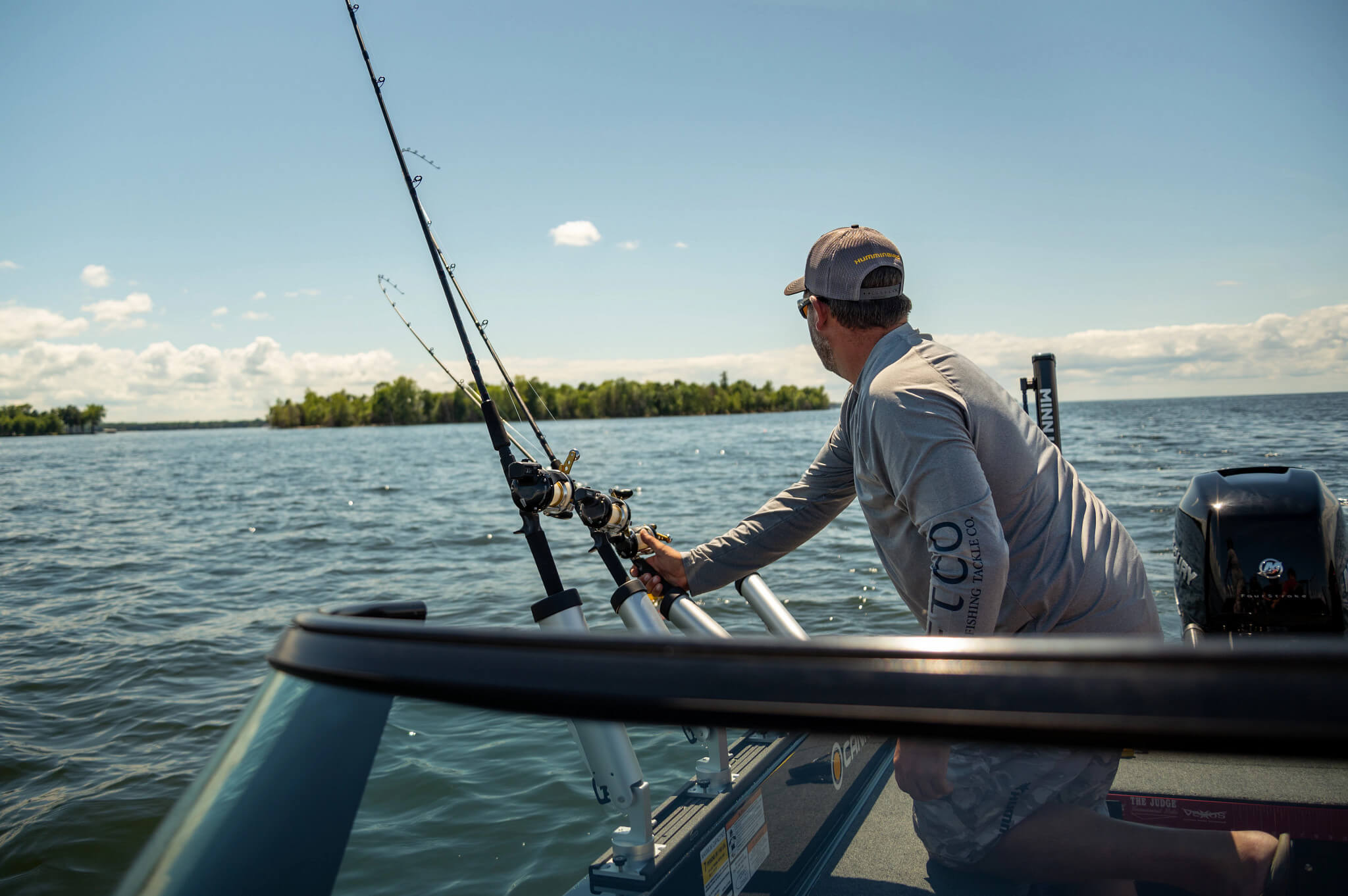 Angler using cannon rod holders